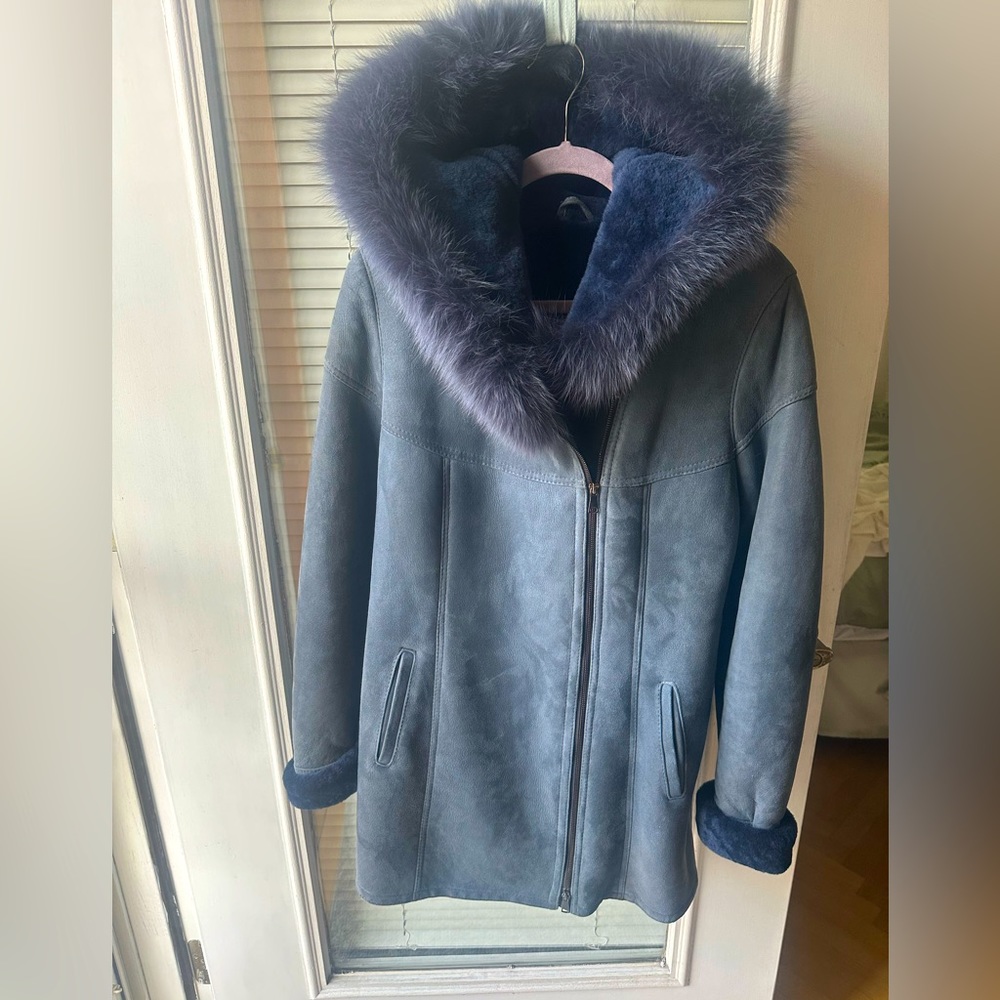 Blue shearling coat in size Medium with fox trimmed hood from Europe.